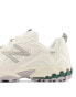 New Balance 610 trainers in white and green