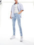 ASOS DESIGN skinny jeans in light wash blue with thigh rip