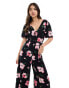 ASOS DESIGN spun flutter sleeve wide leg jumpsuit in dark based floral print