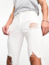 ASOS DESIGN spray on jeans with power stretch with heavy rips in white