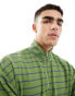 ASOS DEIGN oversized half zip sweatshirt in green with multicolour stripe