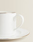 Rimmed bone china teacup and saucer