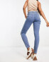 ASOS DESIGN ultimate skinny jean in mid blue with knee rips