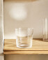 Raised design glass tumbler