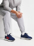 New Balance 327 trainers in navy and red