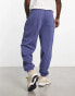 ASOS DESIGN oversized joggers in navy with collegiate multiplacement print