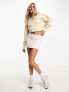 Calvin Klein Jeans cropped crew neck seaming sweatshirt in beige - exclusive to ASOS