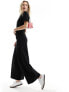 ASOS DESIGN ruched side jumpsuit with wide leg in black