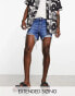 ASOS DESIGN shorter length denim shorts in midwash with rip detail and raw hem