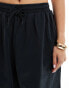 ASOS DESIGN oversized barrel leg pull on trouser in black