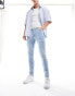 ASOS DESIGN skinny jeans in light wash blue with thigh rip