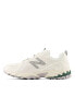 New Balance 610 trainers in white and green