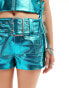 Annorlunda faux leather metallic buckle detail shorts in blue