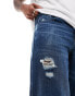 ASOS DESIGN baggy jeans with rips in mid wash blue