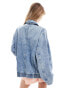 ASOS DESIGN denim bomber in mid wash blue