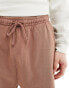 ASOS DESIGN unisex oversized shorts in washed brown