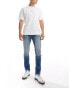 ASOS DESIGN skinny jeans in dark wash blue