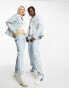 Karl Kani unisex co-ord OG denim trucker jacket in light blue with daisy embroidery