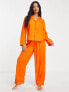 ASOS DESIGN Petite exclusive modal shirt & trouser pyjama set with contrast piping in orange