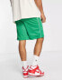 The Couture Club co-ord mesh varsity shorts in green with racer print