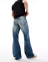 Weekday Time loose fit bootcut jeans in streaky blue wash