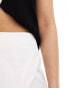 In The Style exclusive wrap front skort in white