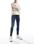 ASOS DESIGN spray on jeans with power-stretch in dark wash blue