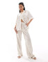 The Couture Club co-ord emblem print wide leg trousers in beige