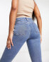 ASOS DESIGN ultimate skinny jean in mid blue with knee rips