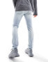 ASOS DESIGN skinny jeans with rips in light blue tinted wash