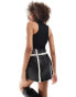 SNDYS leather look contrast borg detail mini skirt co-ord in black