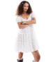 Monki textured babydoll mini dress with tiered hem and puff sleeves in white