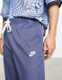 Nike Club woven tapered trousers in blue