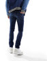 ASOS DESIGN skinny jeans in mid wash blue