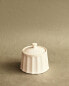 Stoneware sugar bowl with raised design