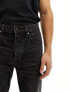 ASOS DESIGN straight leg jeans with knee rip in vintage washed black