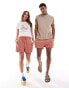 ASOS DESIGN unisex shorter length slim shorts in washed pink