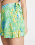 ASOS DESIGN wrap tie skort in green meadow floral print