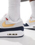 Nike Air Max 1 SC trainers in white, navy and gold