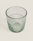 Raised design glass tumbler