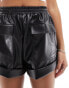 ASOS DESIGN leather look turn up utility shorts in black