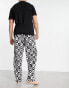 ASOS DESIGN pyjama set with t-shirt and trousers in black with fleece printed bottom