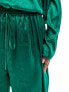 Flounce London Plus satin floaty trousers in emerald green co ord