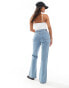 ASOS DESIGN Petite mid rise flare jeans in light blue