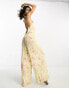 Reclaimed Vintage sleeveless jumpsuit in creamy floral