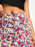 ASOS DESIGN Petite button through mini skirt in ditsy floral