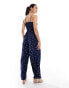 Wednesday's Girl polka dot smocked jumpsuit in navy and cream