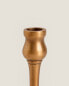 Thin golden candleholder