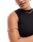 ASOS DESIGN Curve arm cuff with wraparound design with ball ends in gold tone