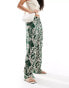 JDY wide leg pull on trouser in beige with tropical print